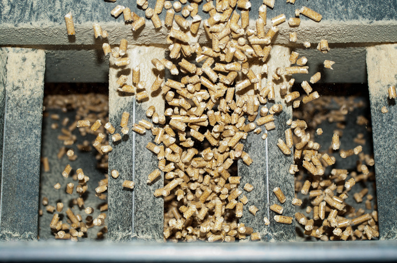 Pellets falling onto a conveyor at the Malheur Lumber Mill in John Day, Ore. flickr/Oregon Department of Forestry